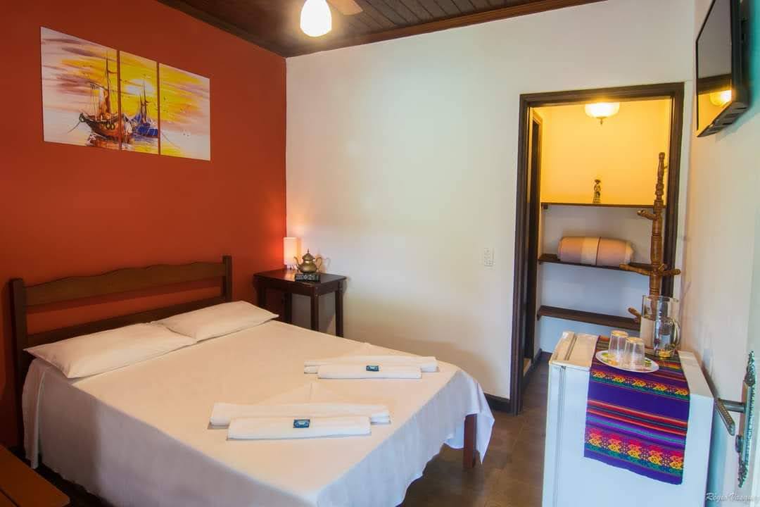 Quarto aconchegante Pousada Taquinha